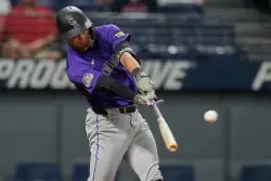Rockies bat around in ninth for comeback win over Guardians in series opener